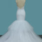 2024 Mermaid Spaghetti Straps Tulle With Applique Open Back Wedding Dresses
